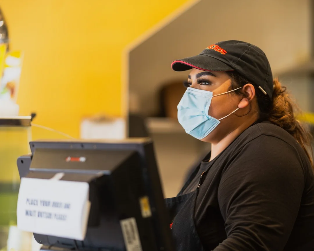 Benny's Tacos team serving customers during the COVID-19 period