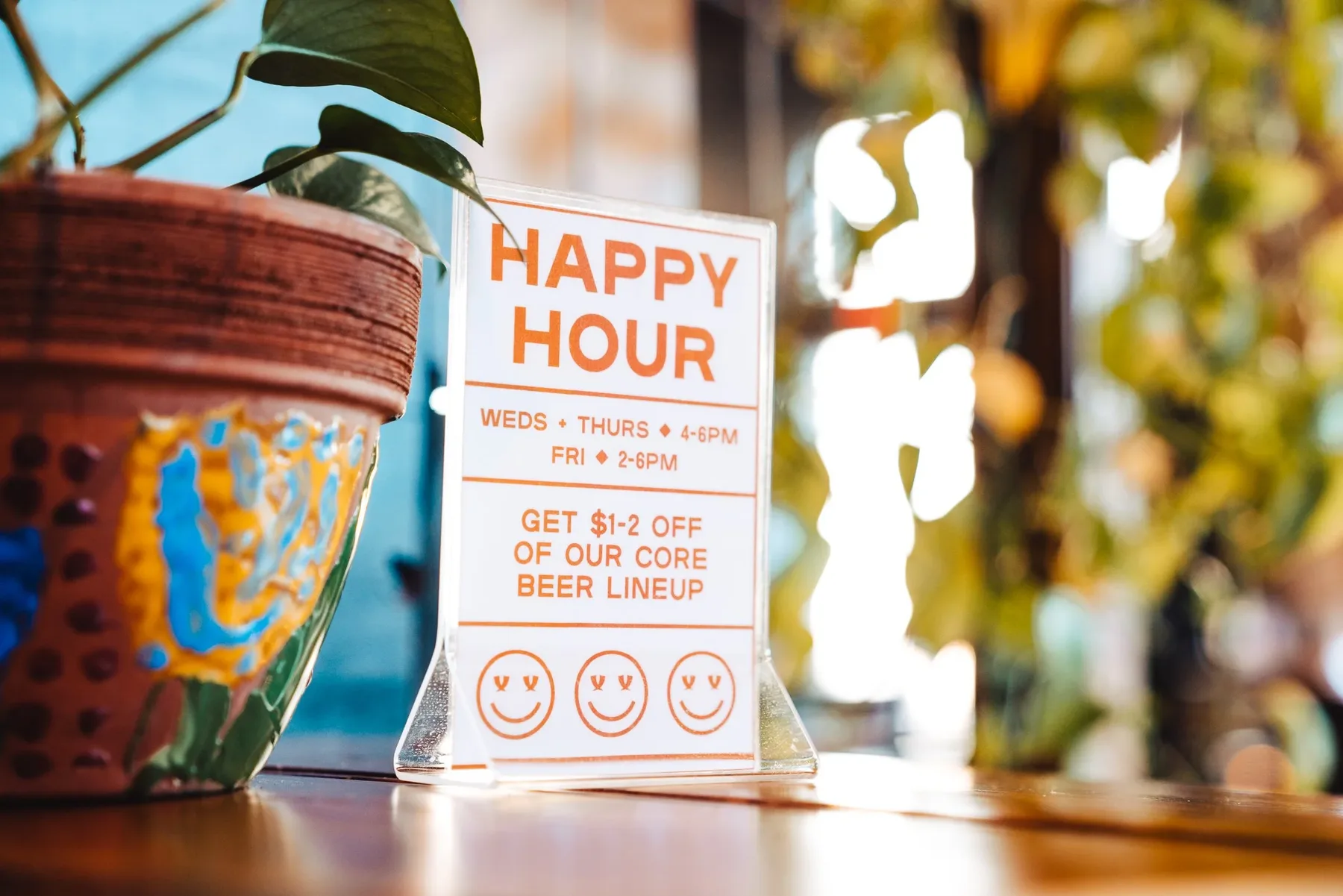 Happy hour sign inside a local brewery